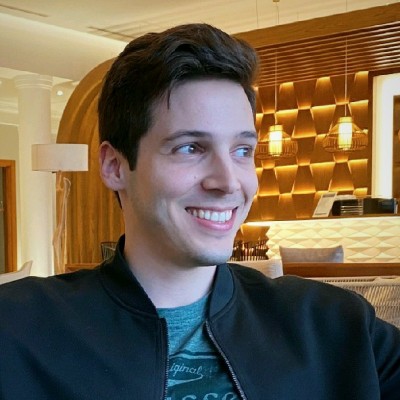 Diogo Seca, smiling, in a warmly lit room